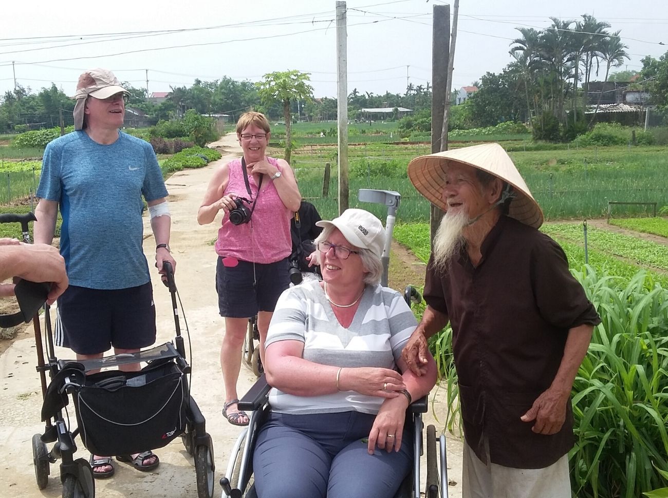 wheelchair users having a tour of the rice paddies