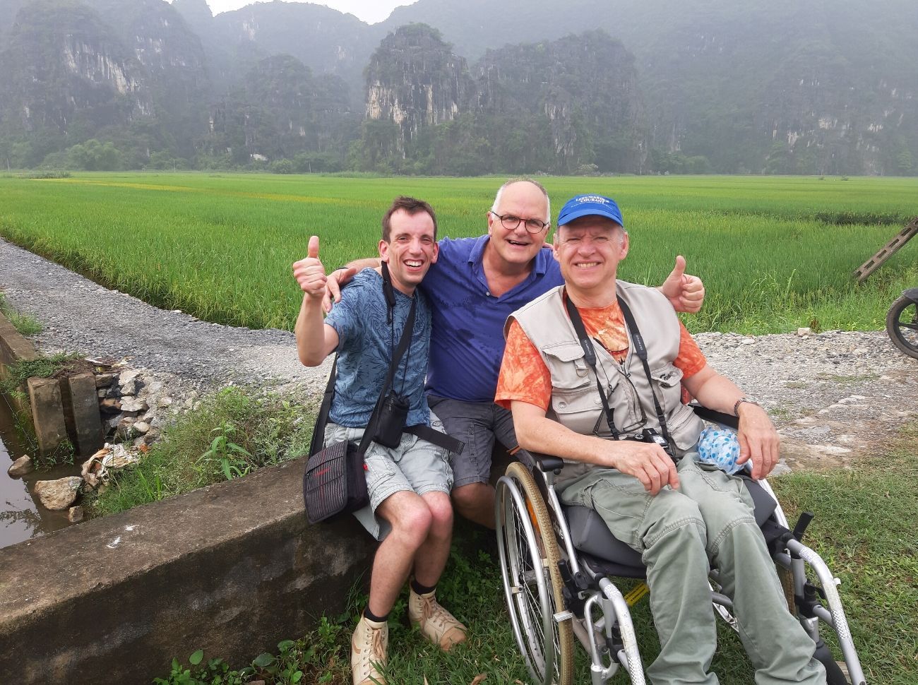 wheelchair users smiling at the dry Halong Bay