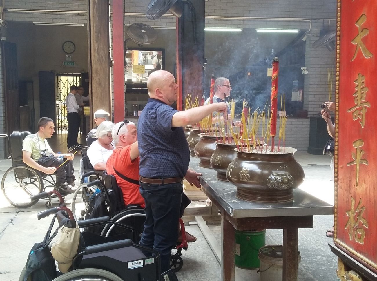 wheelchair users looking at the candles
