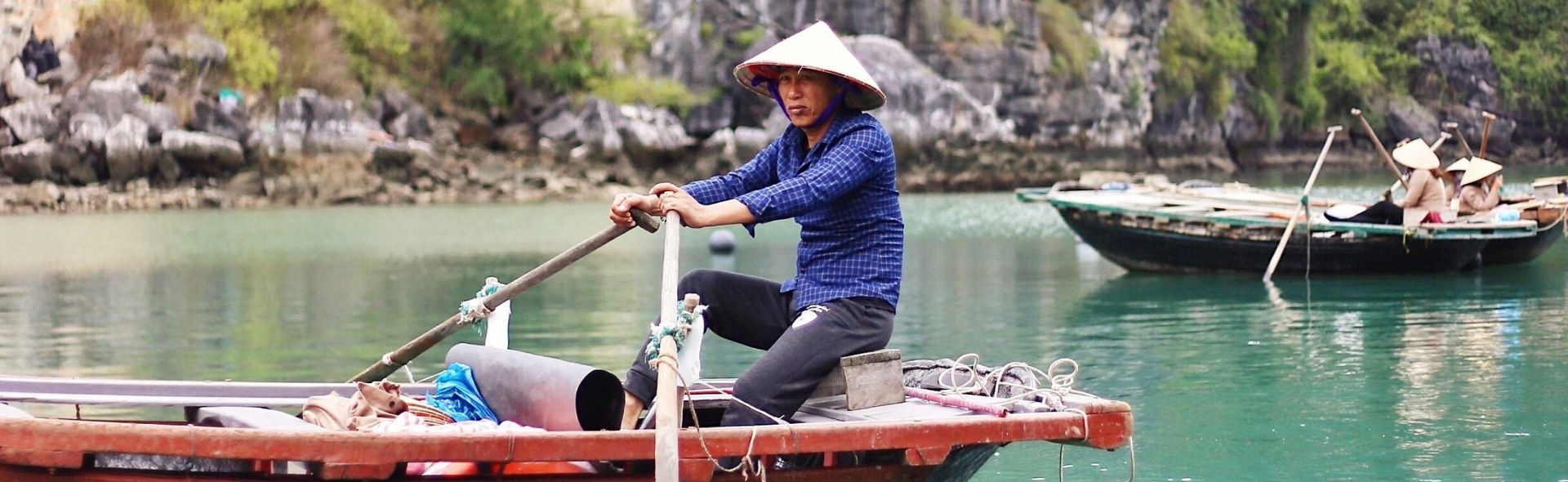 Vietnamese man travelling down Halong Bay